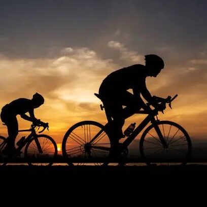 silhouette two road bike cyclist man cycling in the morning.